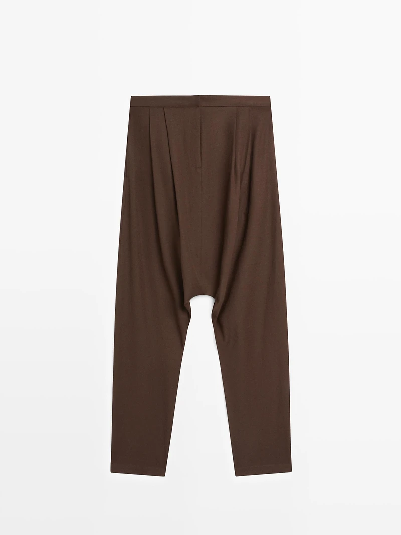 Baggy trousers with pleated details