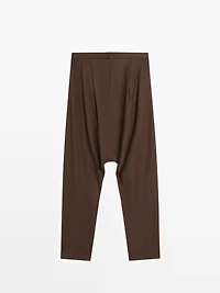 Baggy trousers with pleated details