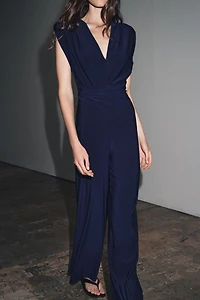 LONG DRAPED SHOULDER PAD JUMPSUIT
