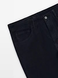 Faux jean en velours côtelé coupe slim