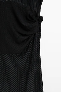 Long flowing printed dress with knot detail