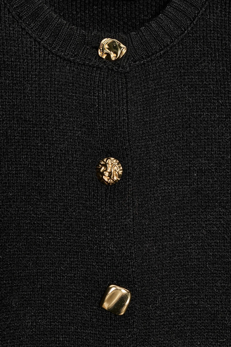 GILET EN MAILLE À ÉPAULES MARQUÉES