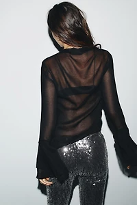 TOP À VOLANTS EN MATIÈRES VARIÉES