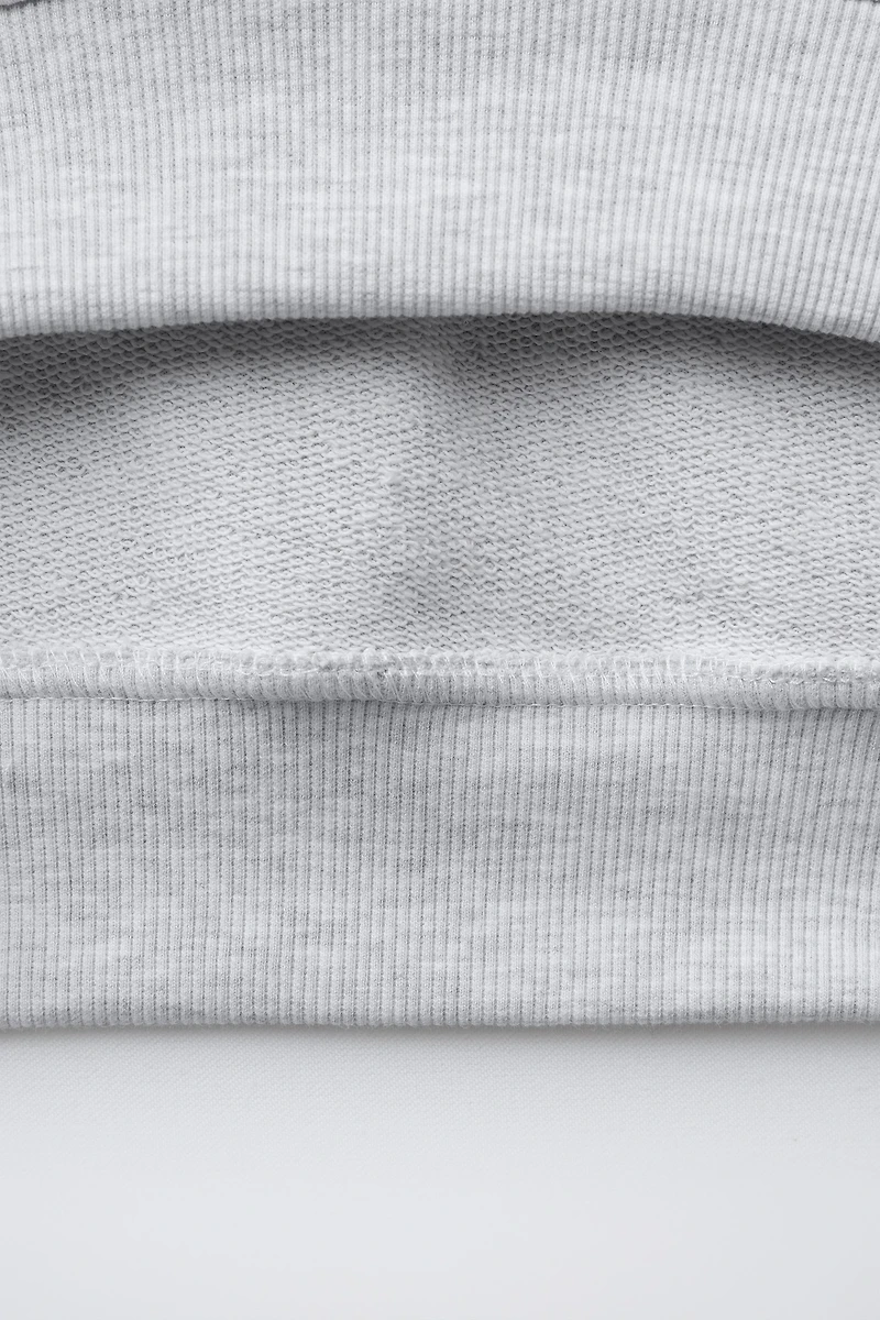 SHORT SLEEVE RAISED SWEATSHIRT
