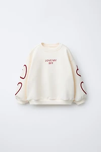 TEXT HEARTS SWEATSHIRT
