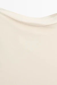Asymmetric drop sleeve top