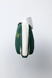 BLOUSON BOMBER CAPUCHE EN MOLLETON AMOVIBLE DÉPERLANT
