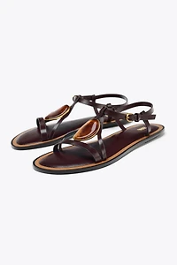 SANDALS WITH METALLIC APPLIQUÉ