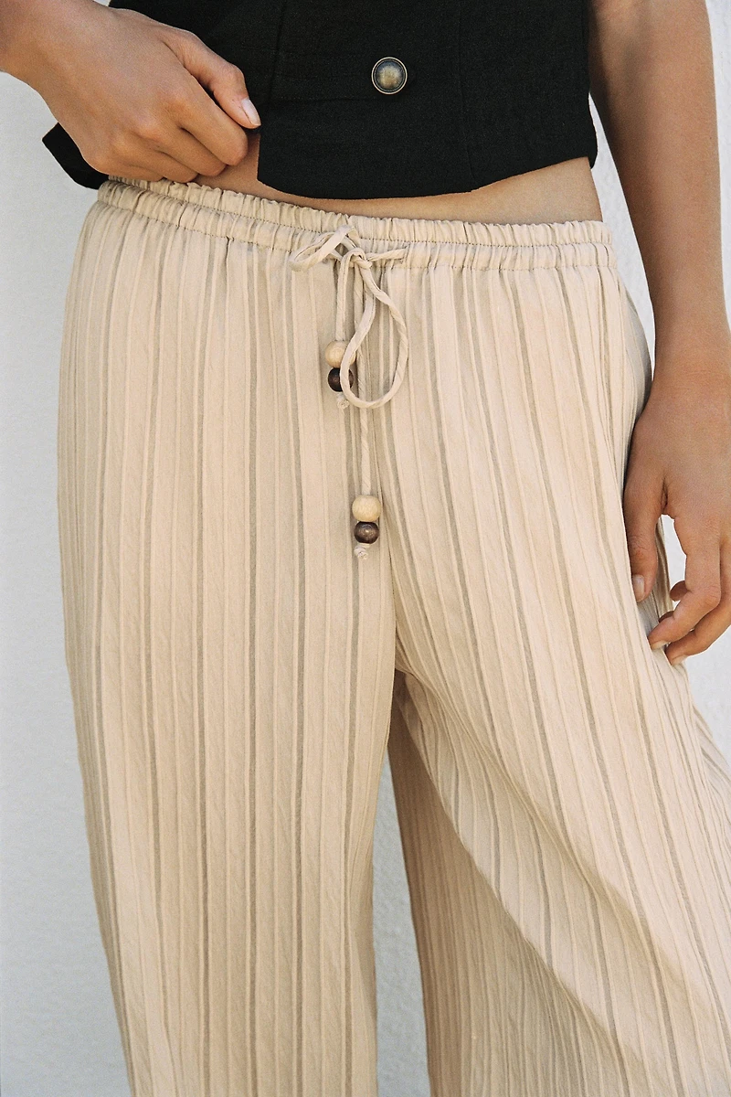 PANTALON LARGE À RAYURES ET TAILLE ÉLASTIQUE