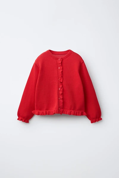 GILET EN MAILLE À PETIT VOLANT