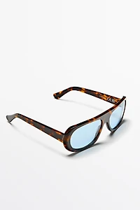 Wide tortoiseshell-effect sunglasses