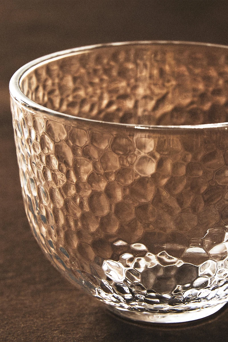 GLASS CUP WITH RAISED DESIGN