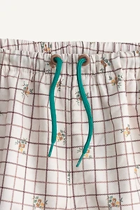 PLAID AND FLORAL LIMITED EDITION SWIM SHORTS