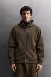 SWEAT TECHNIQUE ZIPPÉ À CAPUCHE