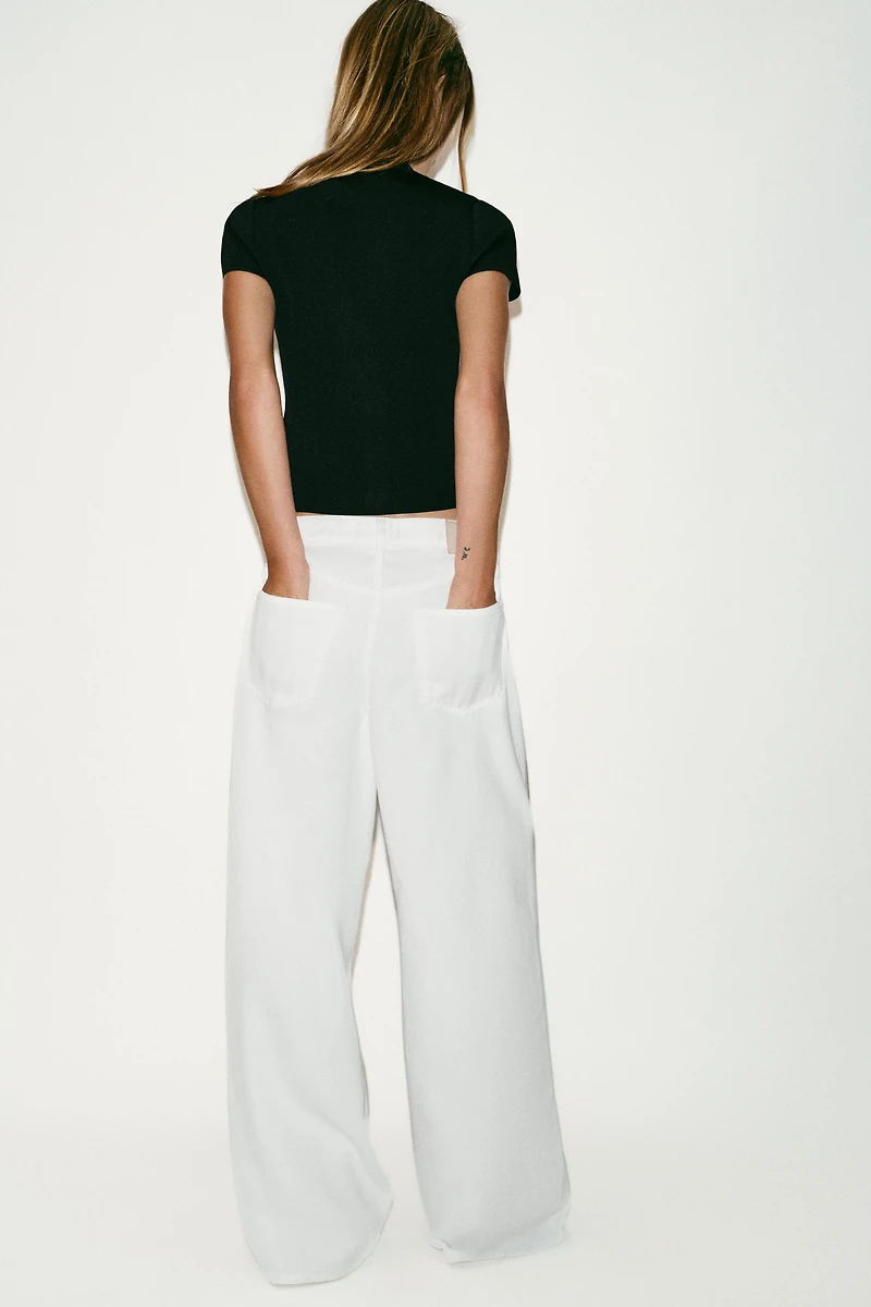 ASYMMETRIC CLOSURE KNIT TOP