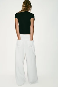 ASYMMETRIC CLOSURE KNIT TOP