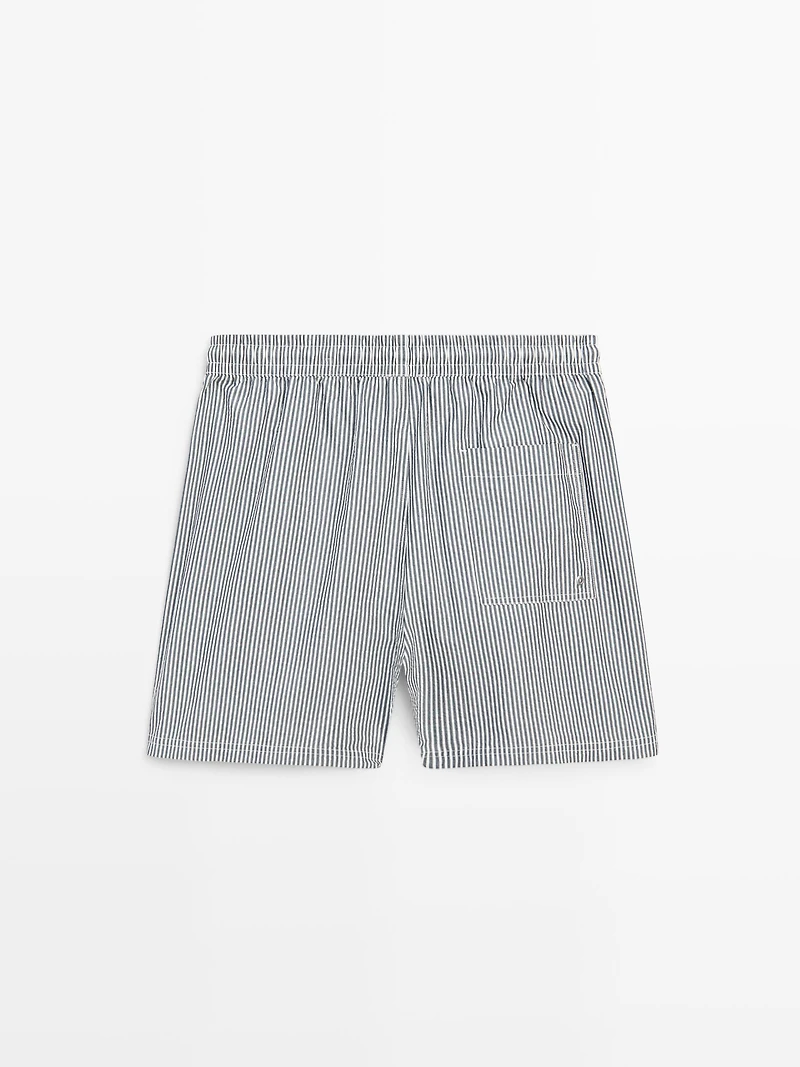 Swimming trunks with striped details