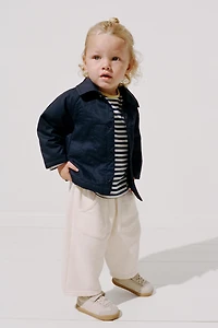 VESTE MATELASSÉE À ÉTIQUETTE