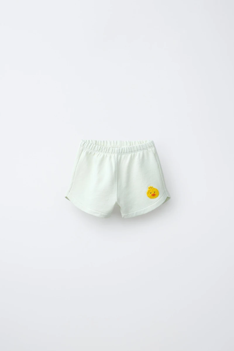 SHORT POUSSIN BRODÉ EN VELOURS BOUCLÉ