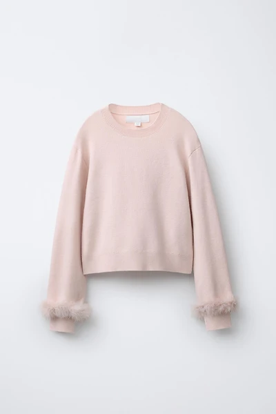 PULL EN MAILLE À PLUMES