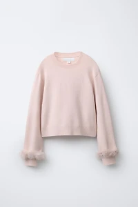 PULL EN MAILLE À PLUMES