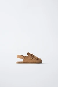 SABOTS EN CUIR PIEDS NUS