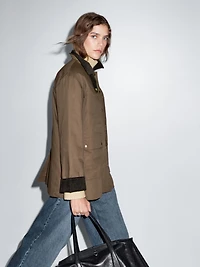 Waxed parka with corduroy detail