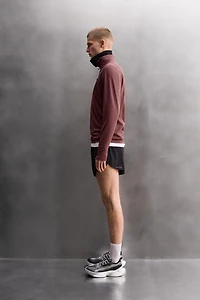 COMBINATION POCKET QUARTER-ZIP SWEATSHIRT