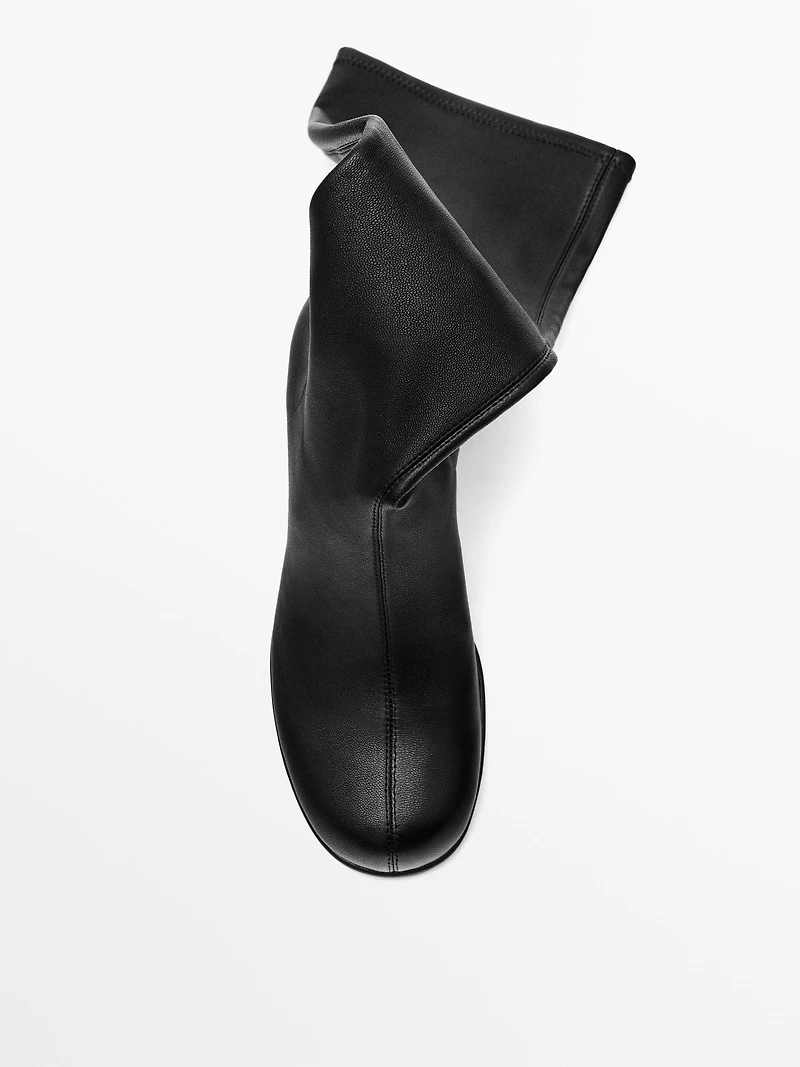 High-heel boots with rounded vamp