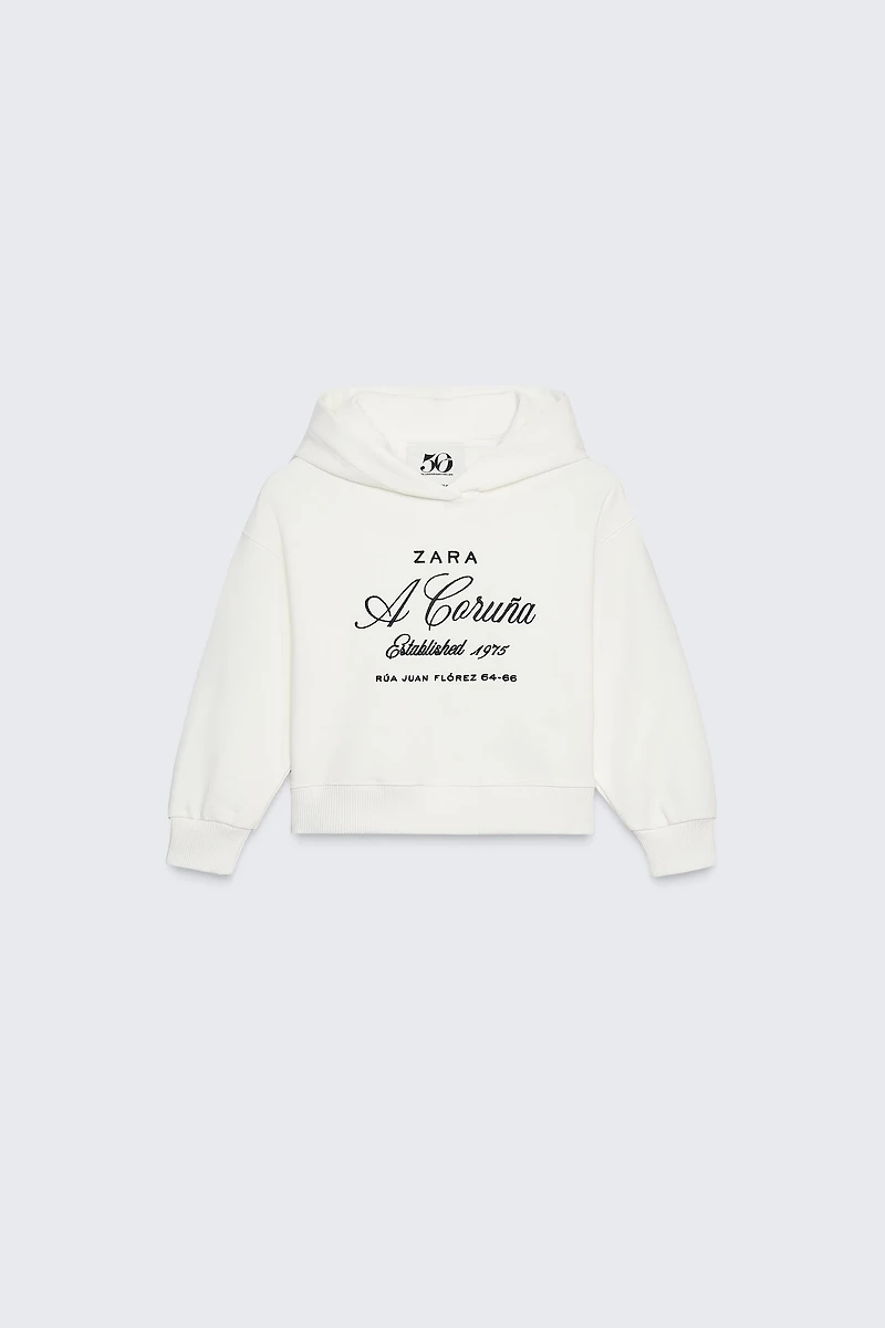 SWEAT À CAPUCHE INSCRIPTION BRODÉE 50TH ANNIVERSARY