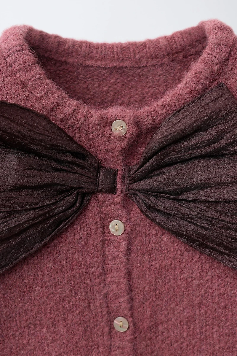 GILET EN MAILLE AVEC NŒUD SATIN