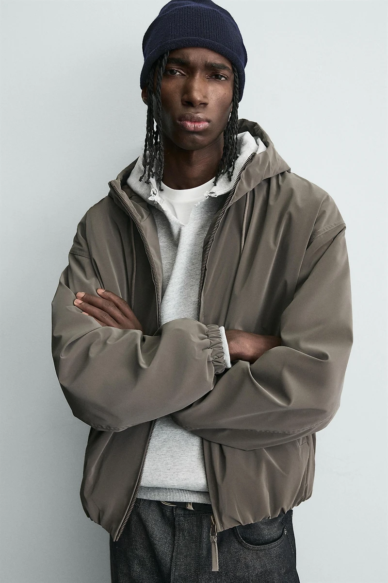 LIGHTWEIGHT HOODED TECHNICAL JACKET
