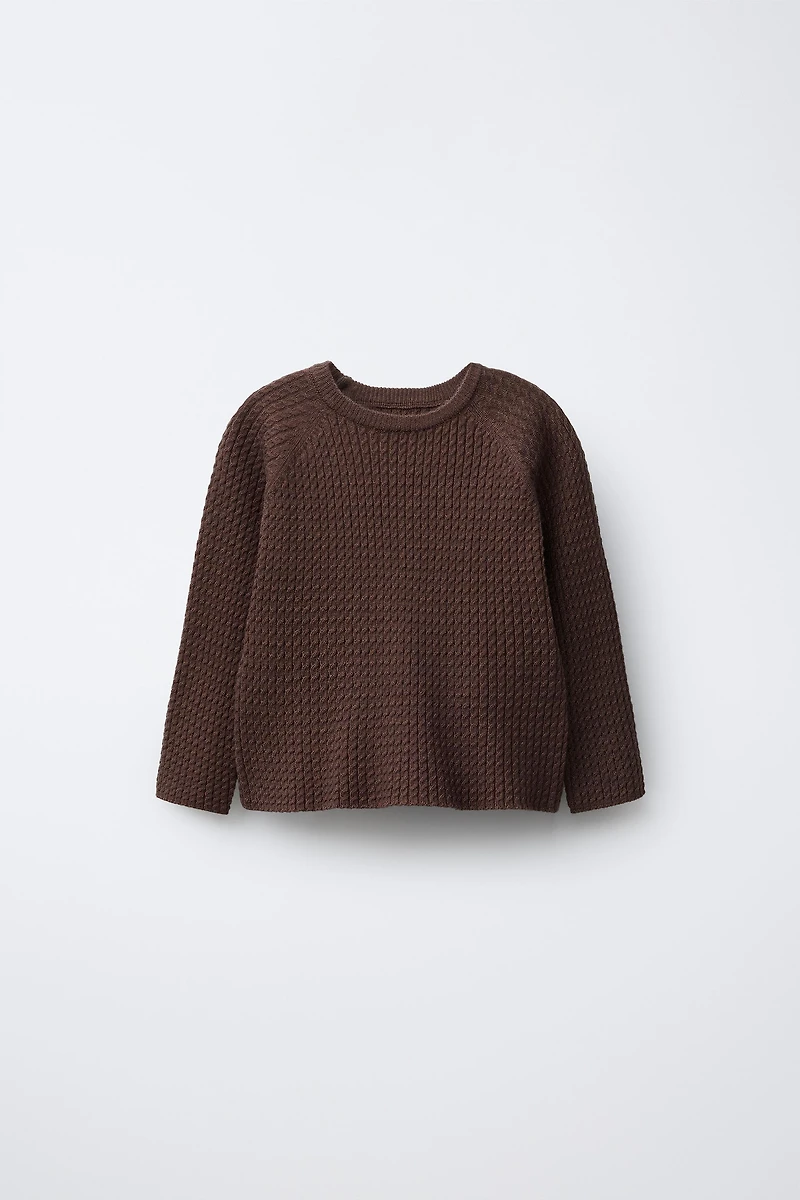 PULL EN MAILLE À TORSADES