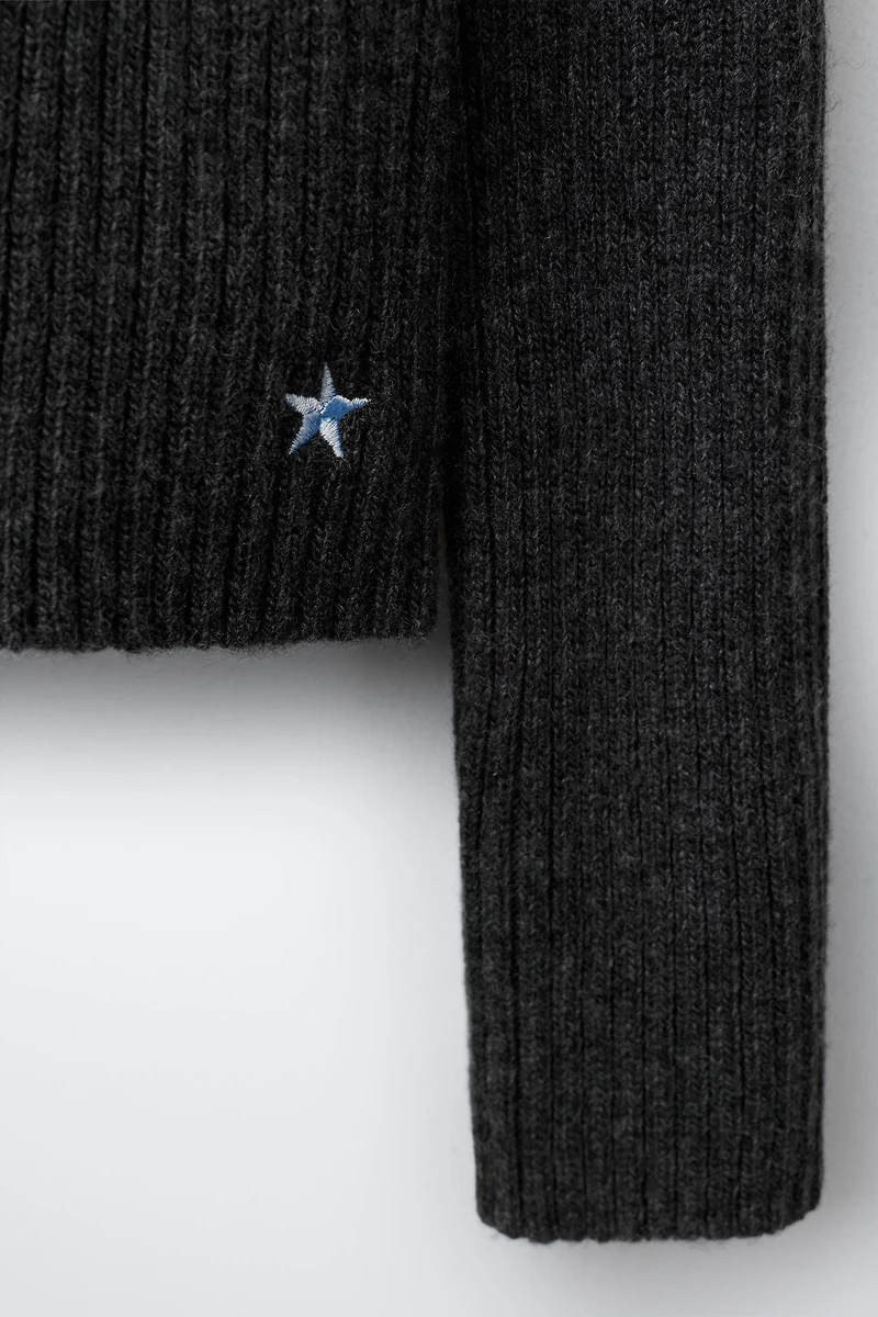 KNIT JUMPER WITH CUT-OUT AND EMBROIDERED STAR