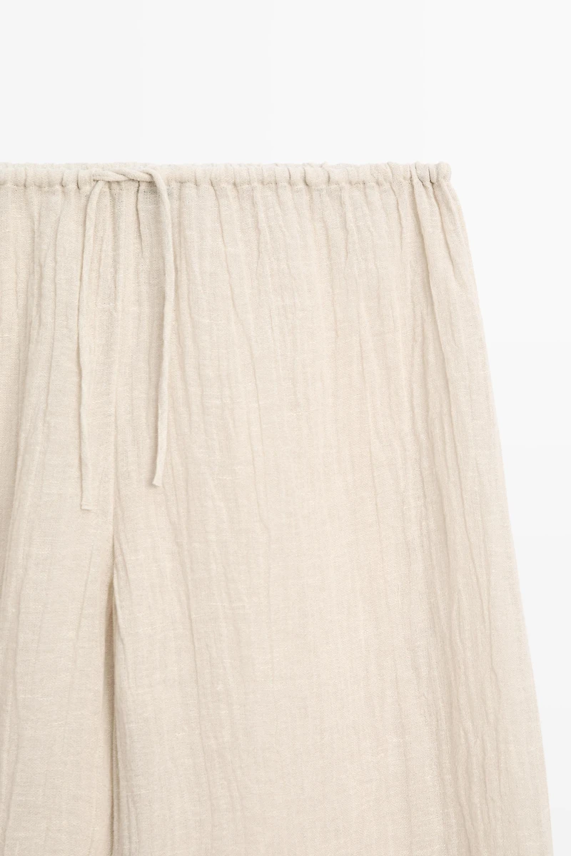 Total look flowing waffle-knit linen blend trousers