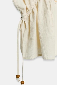 TOP BRODERIES CORDONS LATÉRAUX