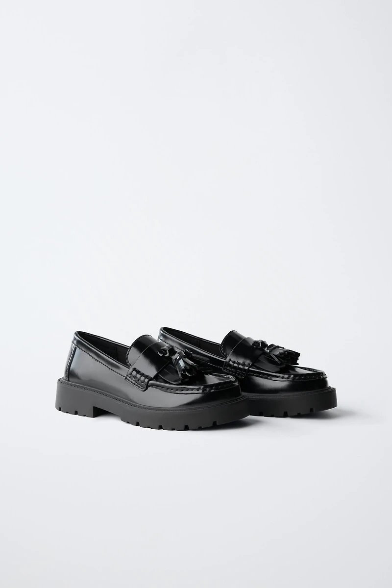 MOCASSINS À POMPONS