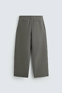 BALLOON FIT PLEATED BELTED PANTS