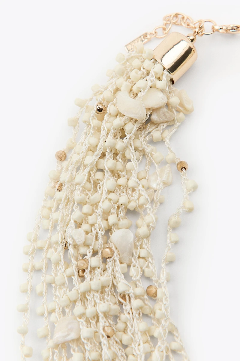 BEADED SHELL BIB NECKLACE