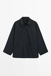 Jacket with buttoned collar strap