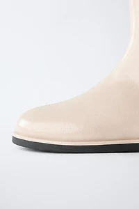 PATENT FINISH ANKLE BOOTS ECRU
