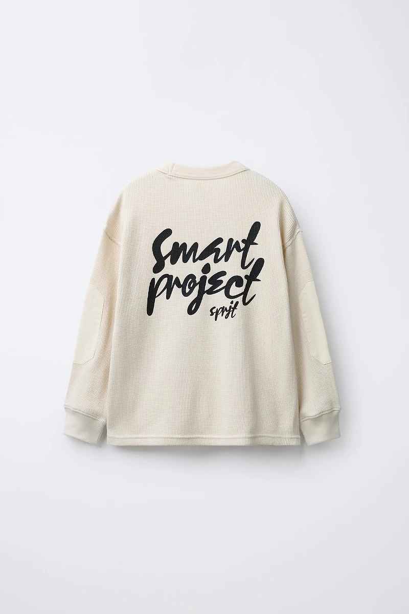 WAFFLE TEXT ELBOW PATCH SWEATSHIRT