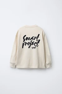 WAFFLE TEXT ELBOW PATCH SWEATSHIRT