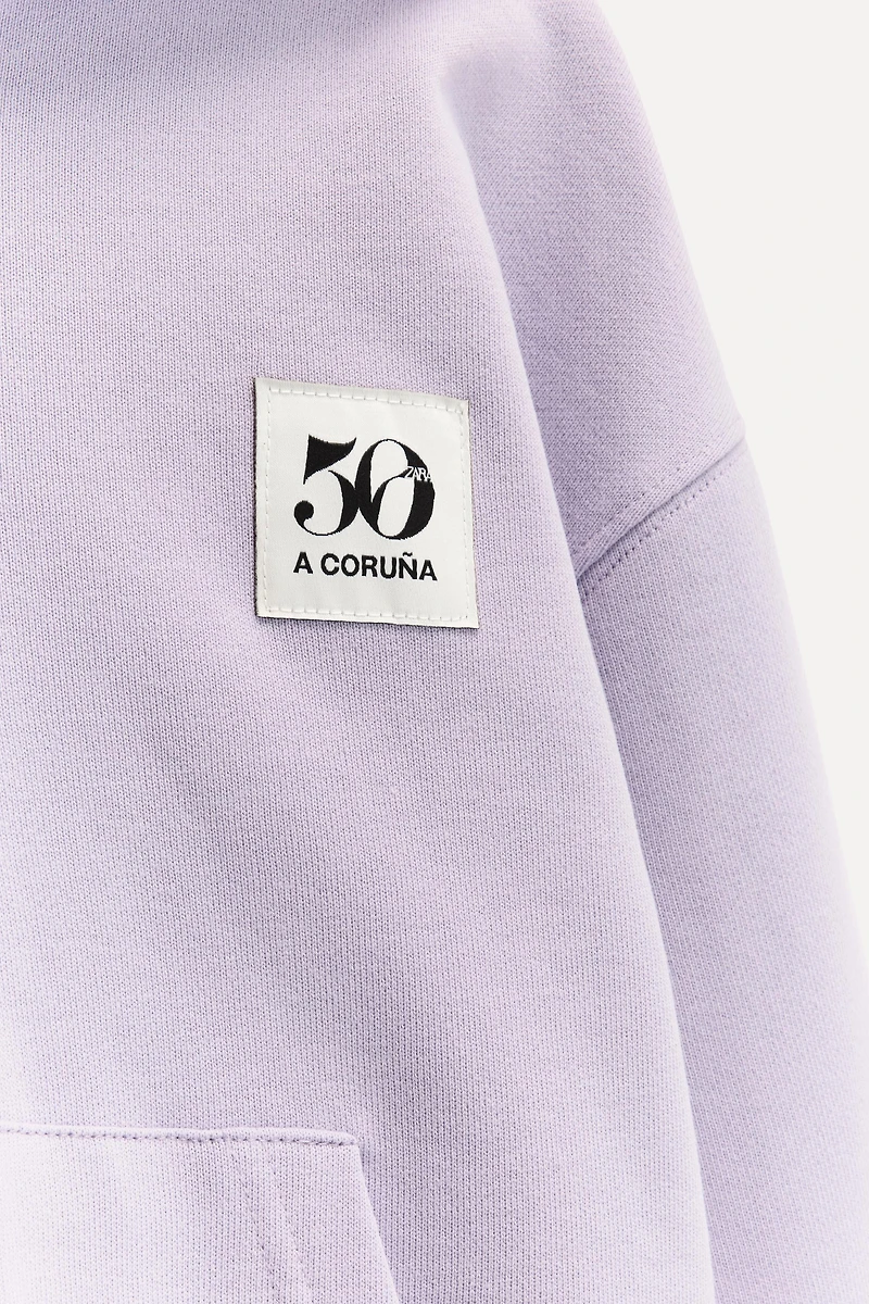 6 YEARS/ 50TH ANNIVERSARY LABEL ZIP-UP SWEATSHIRT