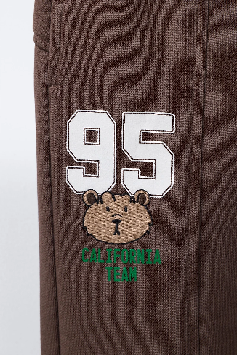 EMBROIDERED ANIMAL NUMBER JOGGING PANTS