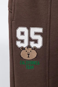 EMBROIDERED ANIMAL NUMBER JOGGING PANTS