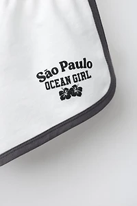 CONTRAST TEXT SHORTS