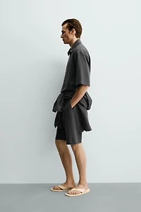 IRREGULAR TEXTURE PLEATED SHORTS