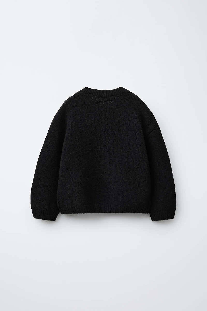 PULL EN MAILLE À FLEURS