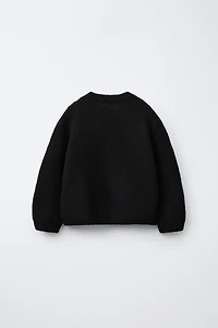PULL EN MAILLE À FLEURS